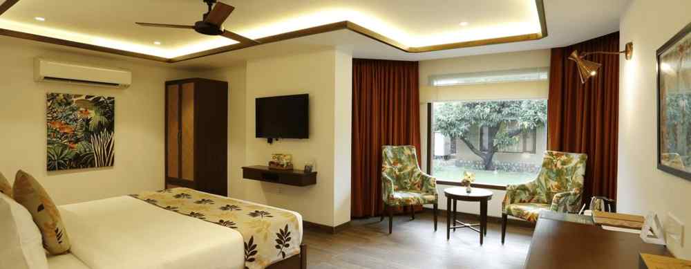 A full view of the furnished room with a bed and a glass window - The Riverview Retreat, Corbett