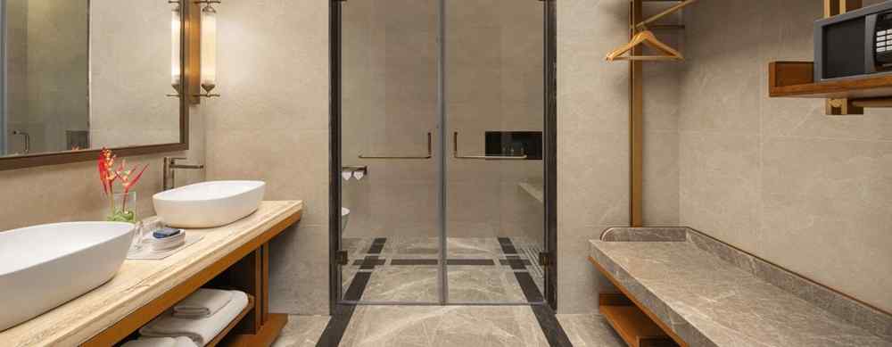 Spacious and modern washroom of the Sanctuary Suite at The Riverview Retreat, Corbett, with double sinks and a glass shower.