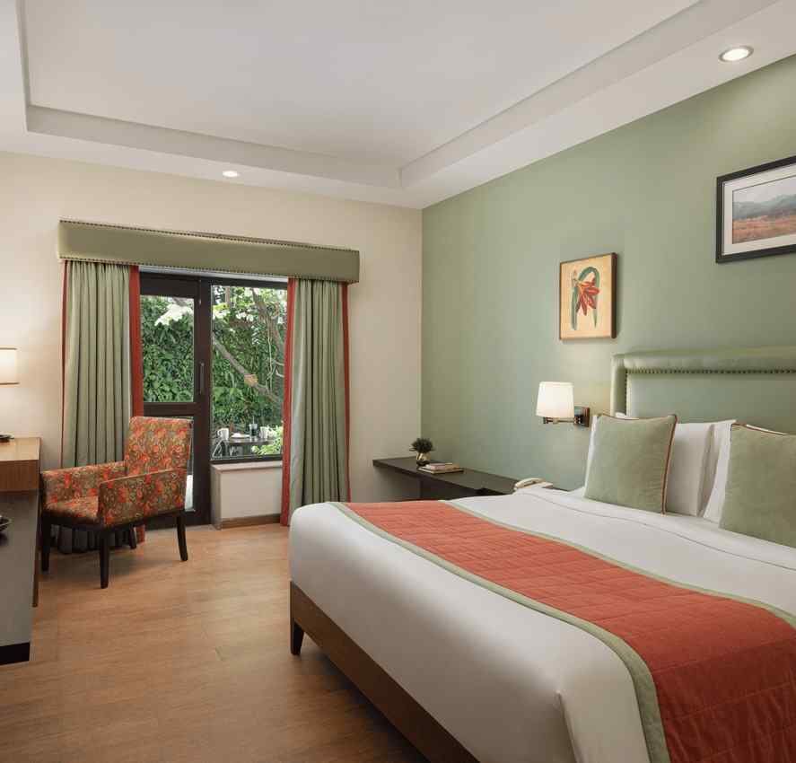 Comfortable bedroom at The Riverview Retreat Corbett with cosy bedding warm lighting and elegant interiors