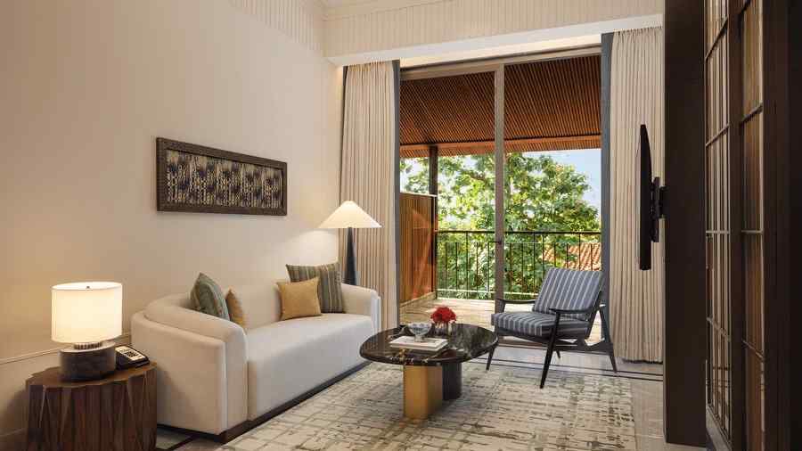 Cosy Sanctuary Suite Living Area at The Riverview Retreat, Corbett, featuring a sofa, armchairs, and contemporary decor.