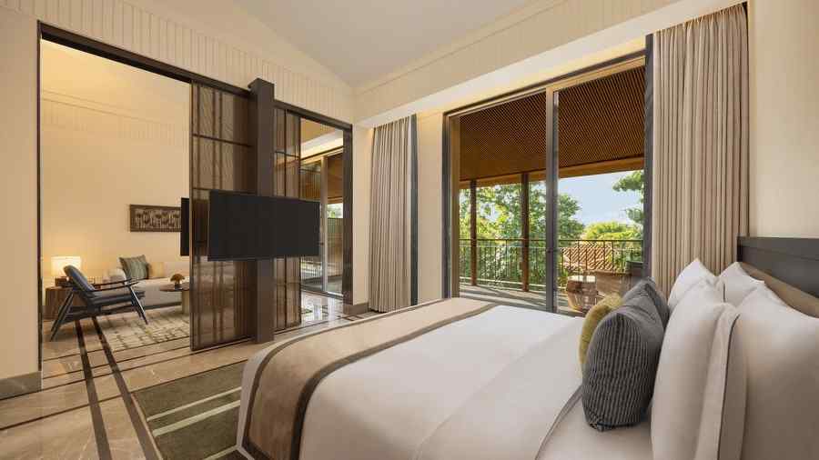 Interior of a Sanctuary Suite Bedroom at The Riverview Retreat, Corbett, showing a spacious bed and modern decor.