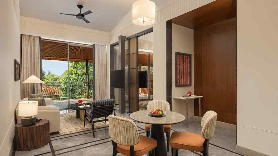 Elegant Sanctuary Suite Living Area at The Riverview Retreat, Corbett, with seating, dining table, and natural light.