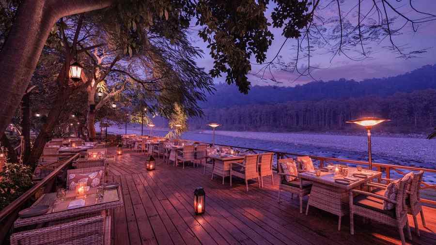 An image of an outdoor dining area beside a lake - The Riverview Retreat,  Corbett
