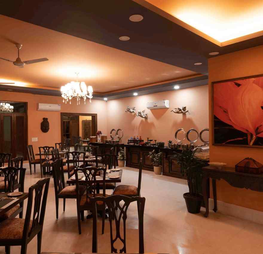An image of  modern restaurant interior of Atman, dharamshala with stylish furniture and artwork.