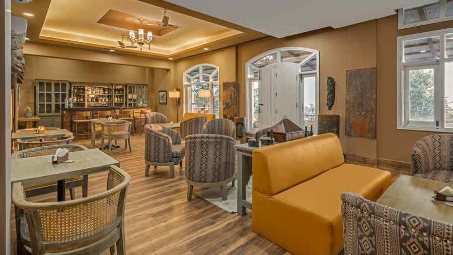 view of a lounge with sofas and chairs placed around tables in clusters - Atman, Dharamshala