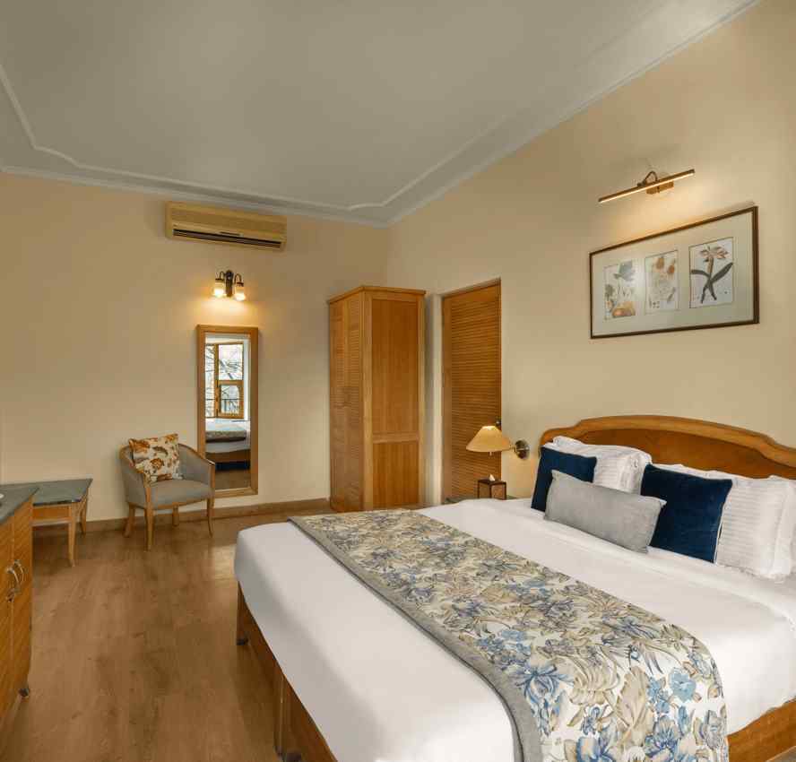 Spacious Superior Cottage Hill View with wooden finish and comfy bed at Baikuth resort, kasauli.
