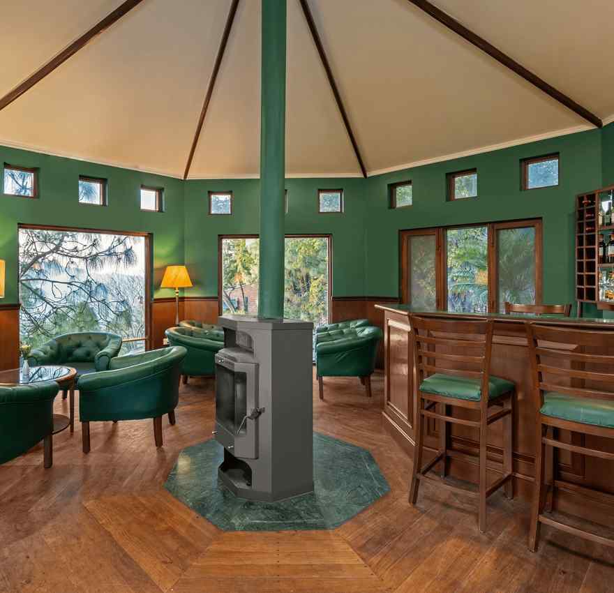 Beautiful and wooden interior of bar with chairs and sofas at Baikunth resort, kasauli.