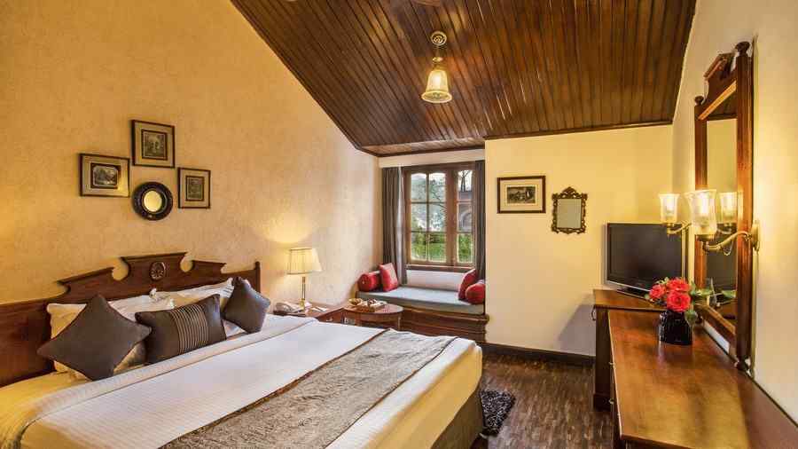 A side view of garden facing rrom with a bed -the naini retreat, nainital.